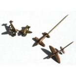 Four WWII Spitfire brooches made from coins, the largest with a wingspan of 3cms (1.25ins).