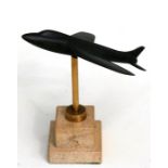 A black coated metal model of the Hawker Hunter jet aircraft mounted on a marble base. Overall