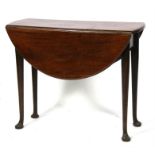 An 18th/ 19th century solid mahogany pad foot drop leaf table of smaller proportions with turned