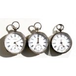 Three silver open faced pocket watches, each with white enamelled dials with Roman numerals and