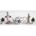 A Dresden teapot of globular form decorated with flowers; together with a pair of continental