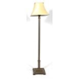 A chinoiserie lacquered standard lamp with reeded column on stepped square base.