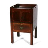 A George III mahogany night stand, the galleried top with pierced carrying handles, with cupboard