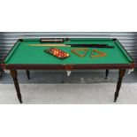 A quarter size snooker table complete with balls & cues.