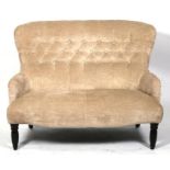 A modern button back upholstered two-seater sofa on turned front supports, 118cms (46.5ins) wide.