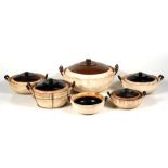 A group of Chinese graduated two-handled lidded bowls, the largest 34cms (13.5ins) diameter.