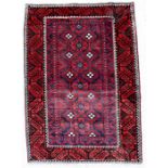 A handmade Persian Baluch rug with geometric design on a red ground, 220 by 125cms (86.5 by 49.