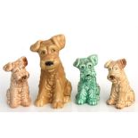 Four Sylvac pottery dogs, the largest 17.5cms (7ins) high.