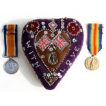 A WW1 Royal Navy sweetheart pin cushion with a WW1 medal pair named to S.S.118007 Stoker E. Upchurch