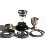 A silver polo trophy; two silver bangles; a silver napkin ring; and other items.