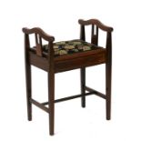 An Edwardian inlaid mahogany piano stool, 47cms (18.5ins) wide.