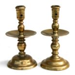 Two 18th century brass candlesticks, the largest 19cms (7.5ins) high.Condition ReportRepair to the