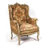A French carved and distressed painted upholstered armchair. Condition Report It has been re-