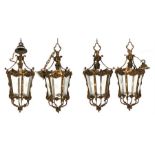 A set of four Georgian style bronze hall lanterns of hexagonal tapering form, 40cms (15.75ins)