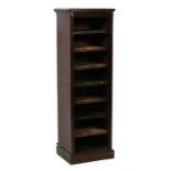 A Victorian walnut bank of shelves standing on a plinth base, 43cms (17ins) wide.