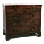 A 19th century mahogany chest, a brushing slide above two short and three long graduated drawers, on