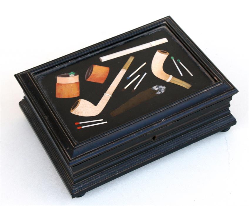 A late 19th century pietra dura inlaid marble topped ebonised cigarette box decorated with pipes,