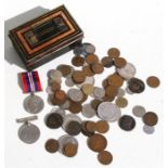 A small tin of assorted coins, medals and medallions