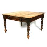 A Victorian pine kitchen table with single drawer, on turned legs, 126cms (49.5ins) wide.