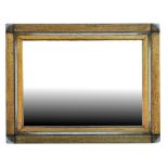 A distressed gilt framed wall mirror, 102cms (40ins) wide.