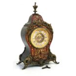 A 19th century French tortoiseshell Boulle work mantle clock with open escarpment movement, the