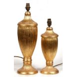 Two Peter Martin Design gilded table lamps, the largest 44cms (17.5ins) high.
