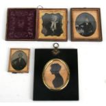 A 19th century portrait miniature silhouette; together with three daguerreotypes.