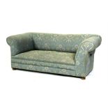 An Edwardian drop-end Chesterfield sofa, 177cms (69.5ins) wide.