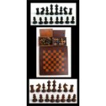 A mahogany games board together with a chess set and draught set.Condition ReportTwo draughts