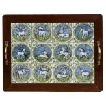 A mahogany framed two-handled tray inset with twelve ceramic tiles hand painted with unicorns, 52cms