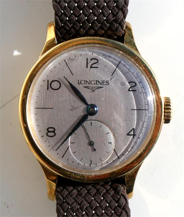 An 18ct gold cased gentleman's Longines wristwatch, the silvered dial with baton and Arabic