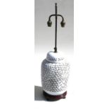 A Chinese blanc de chine style pierced table lamp, 38cms (15ins) high.
