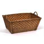 A large French wicker two-handled bread or log basket, 78cms (30.75ins) wide.