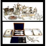 A quantity of silver plate to include a four-piece tea set; a pair of silver plated sauce boats,