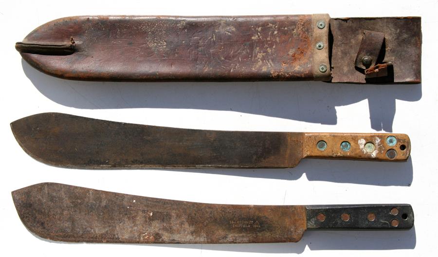 A WW2 Martindale No.22 machete (blade length 37.5cms (14.75ins)) in its leather scabbard marked H.