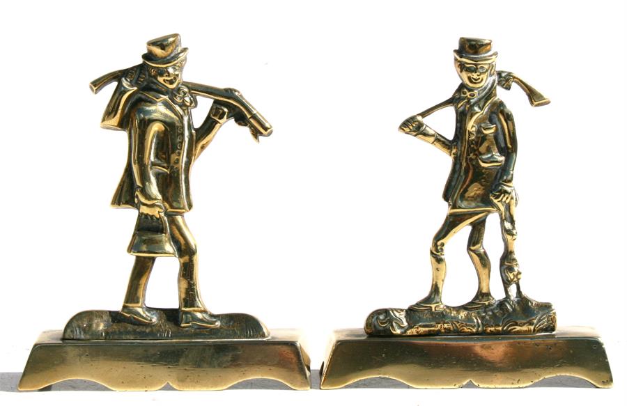 A pair of Victorian brass chimney ornaments in the form of huntsmen, 13cms (5ins) high (2).