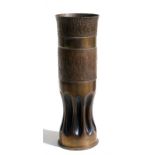 A 1944 dated brass shell case vase with fluted base. 37cms (14.5ins) high by 12cms (4.75ins)