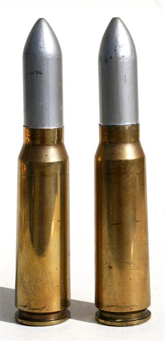 Two inert cannon rounds. 3cms (1.125ins) diameter by 16cms (6.25ins) high