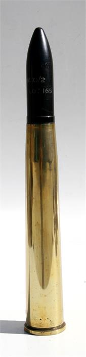 A complete inert 1943 40mm Bofors brass shell case with a later 40mmG Break-Up plastic shell.