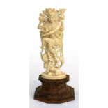 An early 20th century Indian ivory carving in the form of Shiva, mounted on a hardwood plinth, 15cms