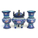A Chinese enamel two-handled censer with pierced cover decorated with flowers on a blue ground, on