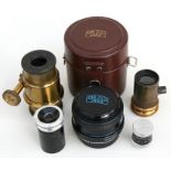 A Carl Zeiss Jena macro camera lens; together with four other lenses.