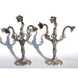 A pair of Art Nouveau silver plated three-arm table lamps of naturalistic form, 43cms (17ins) high.