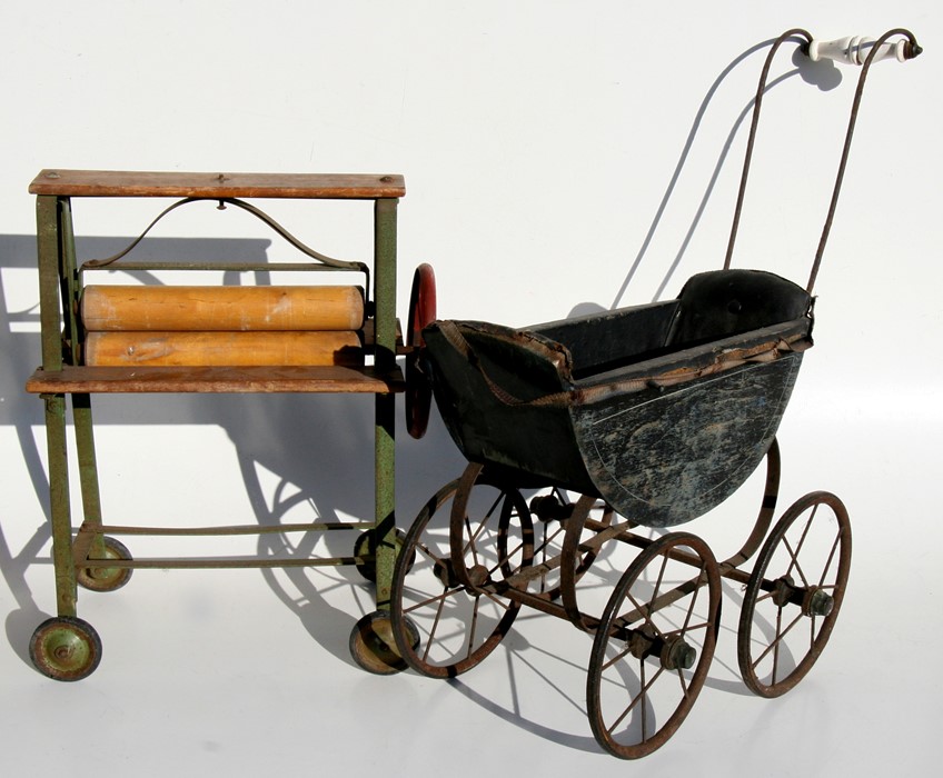 A child's Triang toy mangle; together with a painted wooden dolls pram (2).