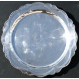 A continental silver salver with scalloped edge, 43cms (17ins) diameter.Condition ReportApprox.