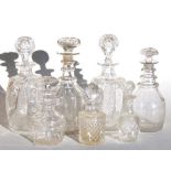 A pair of 19th century cut glass decanters, 26cms (10.25ins) high; together with other Georgian