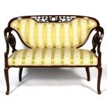 A late 19th century stained walnut salon sofa with upholstered seat and back, on cabriole front