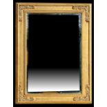 A modern gilt framed bevel edged wall mirror, 76 by 96cms (27.5 by 37.75ins).