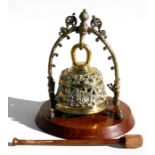 A wall mounted pierced brass dinner gong.