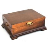 A gentleman's oak fly fishing box, the lift up lid enclosing a sectioned interior, with fly line